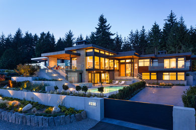 Large contemporary multicolored two-story mixed siding exterior home idea in Vancouver