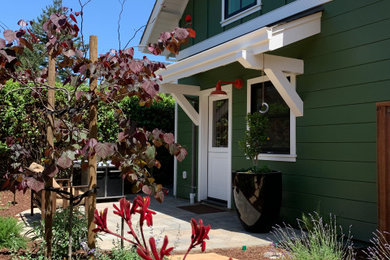 Inspiration for a small craftsman green two-story wood and clapboard exterior home remodel in San Francisco with a shingle roof and a gray roof