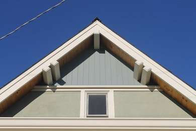 Mid-sized craftsman two-story stucco gable roof idea in San Francisco