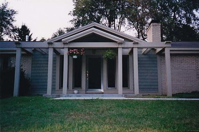 Example of a small transitional gray one-story mixed siding exterior home design in Other