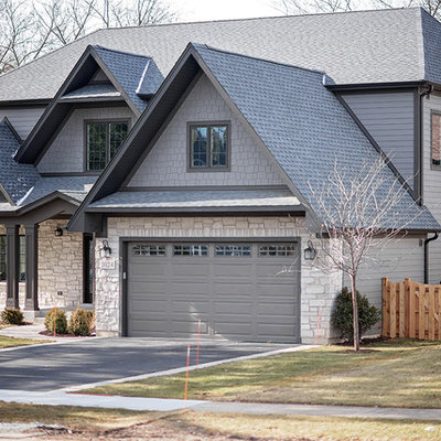 Large traditional gray two-story concrete fiberboard exterior home idea in Chicago with a shingle roof