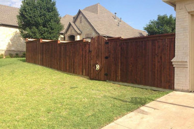 Inspiration for a large and beige traditional two floor brick house exterior in Dallas with a hip roof.