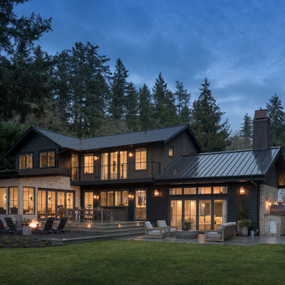 Country multicolored two-story mixed siding exterior home idea in Seattle with a shingle roof