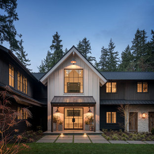 Farmhouse multicolored two-story mixed siding exterior home photo in Seattle with a shingle roof