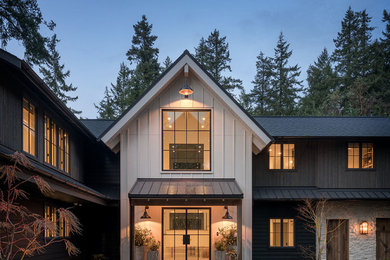 Farmhouse multicolored two-story mixed siding exterior home photo in Seattle with a shingle roof