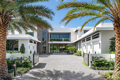 Inspiration for a large contemporary two-story exterior home remodel in Miami