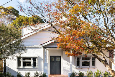 Inspiration for a white contemporary two floor detached house in Melbourne.