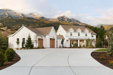 Farmhouse white two-story exterior home photo in Salt Lake City with a shingle roof