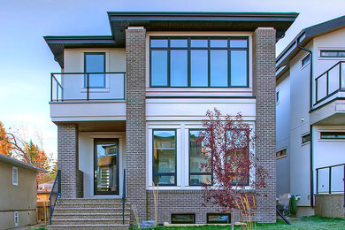 Elegant two-story stucco house exterior photo in Calgary