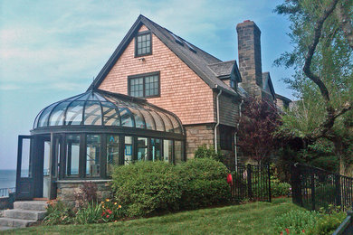 Example of a beige two-story stone exterior home design in New York