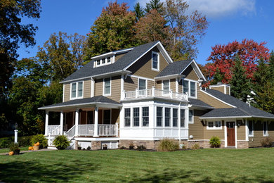 Example of a classic beige exterior home design in New York