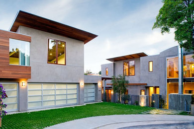 Inspiration for a large modern multicolored three-story concrete flat roof remodel in Los Angeles