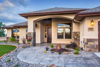 Mid-sized trendy beige one-story stucco house exterior photo in Boise with a hip roof and a shingle roof