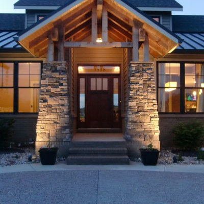 Mid-sized craftsman beige one-story mixed siding exterior home idea in St Louis with a metal roof