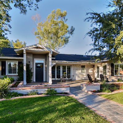 Inspiration for a mid-sized timeless beige one-story mixed siding house exterior remodel in Phoenix with a hip roof and a shingle roof