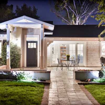 Mid-sized traditional beige one-story mixed siding house exterior idea in Phoenix with a hip roof and a shingle roof