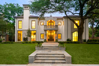 Example of a tuscan white two-story exterior home design in Dallas with a hip roof