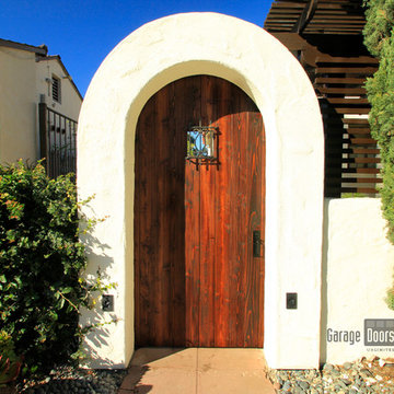 Arched Wood Entry Gate with Iron Design