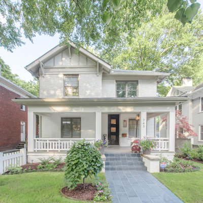 Transitional white two-story brick exterior home photo in Atlanta