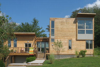 Inspiration for a modern wood exterior home remodel in Other