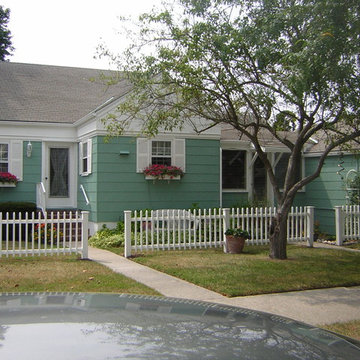 Asbestos Exterior of a Rancher House Painted Green and White in Cape May, NJ