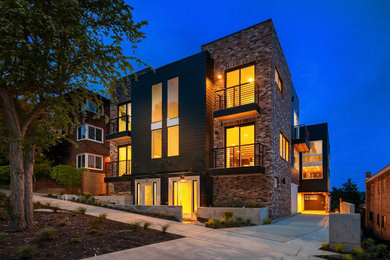 Trendy three-story brick townhouse exterior photo in Seattle