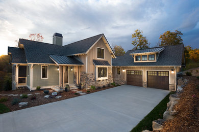 Inspiration for a classic bungalow house exterior in Other with stone cladding.