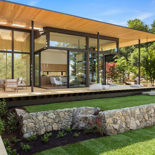 Huge contemporary beige two-story wood exterior home idea in Portland with a shingle roof
