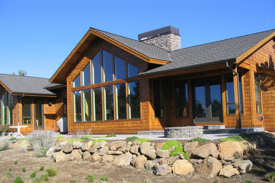 Inspiration for a mid-sized contemporary brown one-story wood exterior home remodel in Other