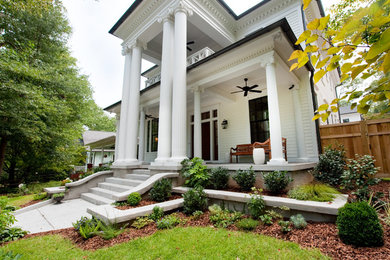 Inspiration for a large timeless white two-story concrete fiberboard house exterior remodel in Atlanta with a hip roof