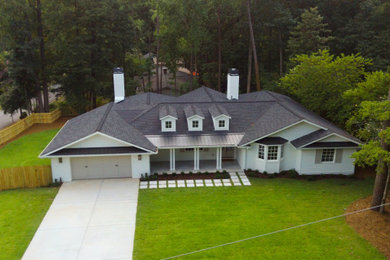 Inspiration for a large timeless white one-story wood exterior home remodel in Atlanta with a shingle roof