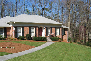 Mid-sized elegant one-story brick house exterior photo in Atlanta with a hip roof and a shingle roof