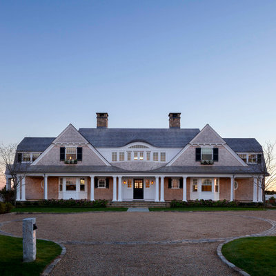 Large coastal beige two-story wood exterior home idea in Boston with a shingle roof