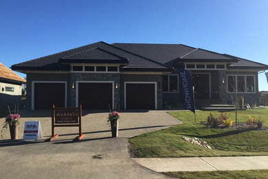 This is an example of a beige classic bungalow house exterior in Edmonton.