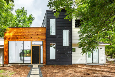 Mid-sized minimalist white two-story mixed siding exterior home photo in Austin with a metal roof
