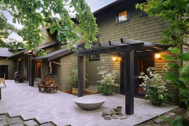 Inspiration for a farmhouse green split-level wood exterior home remodel in Seattle