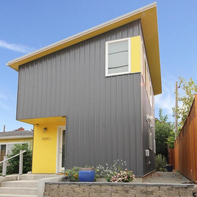 Example of a small trendy gray two-story metal house exterior design in Seattle with a shed roof and a metal roof