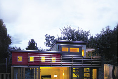 Inspiration for a mid-sized contemporary multicolored two-story mixed siding flat roof remodel in Denver