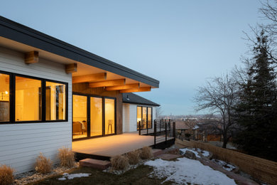 Modern white exterior home idea in Denver