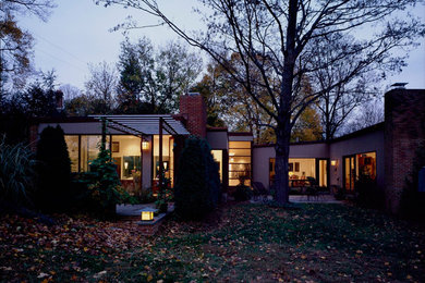 Inspiration for a large and gey contemporary bungalow detached house in Baltimore with wood cladding and a lean-to roof.