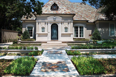 Mid-sized elegant beige two-story mixed siding gable roof photo in Dallas