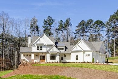 Example of a transitional white gable roof design in Atlanta
