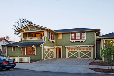 Mid-sized craftsman green two-story wood house exterior idea in Santa Barbara with a hip roof and a shingle roof