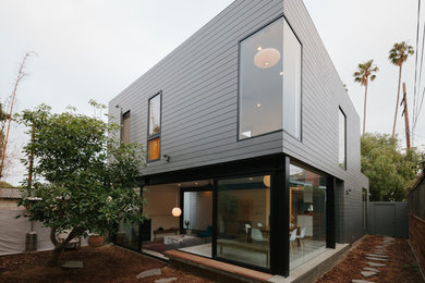 Mid-sized contemporary gray two-story concrete fiberboard flat roof idea in Los Angeles