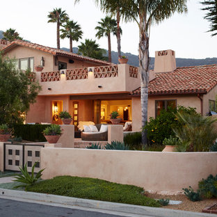 Southwest beige two-story exterior home photo in Other with a tile roof