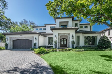 Transitional two-story stucco exterior home photo in Tampa