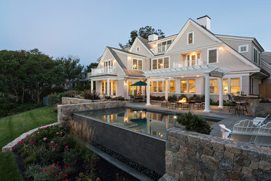 Example of a huge classic three-story exterior home design in Boston