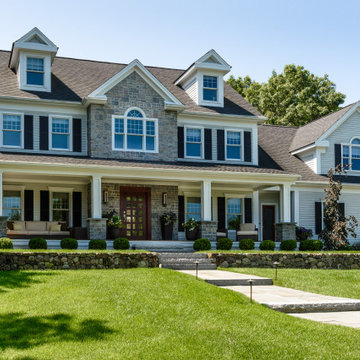 Beautifully crafted stone accents complement the front porch columns