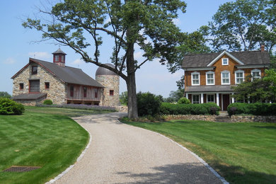 Design ideas for a country house exterior in New York with wood cladding.