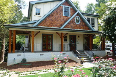 Inspiration for a mid-sized timeless white two-story mixed siding gable roof remodel in Raleigh